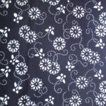 natural artisanal hand dyed blue and white indigo cotton fabric textile floral butterfly pattern