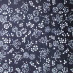 natural artisanal hand dyed blue and white indigo cotton fabric textile floral pattern