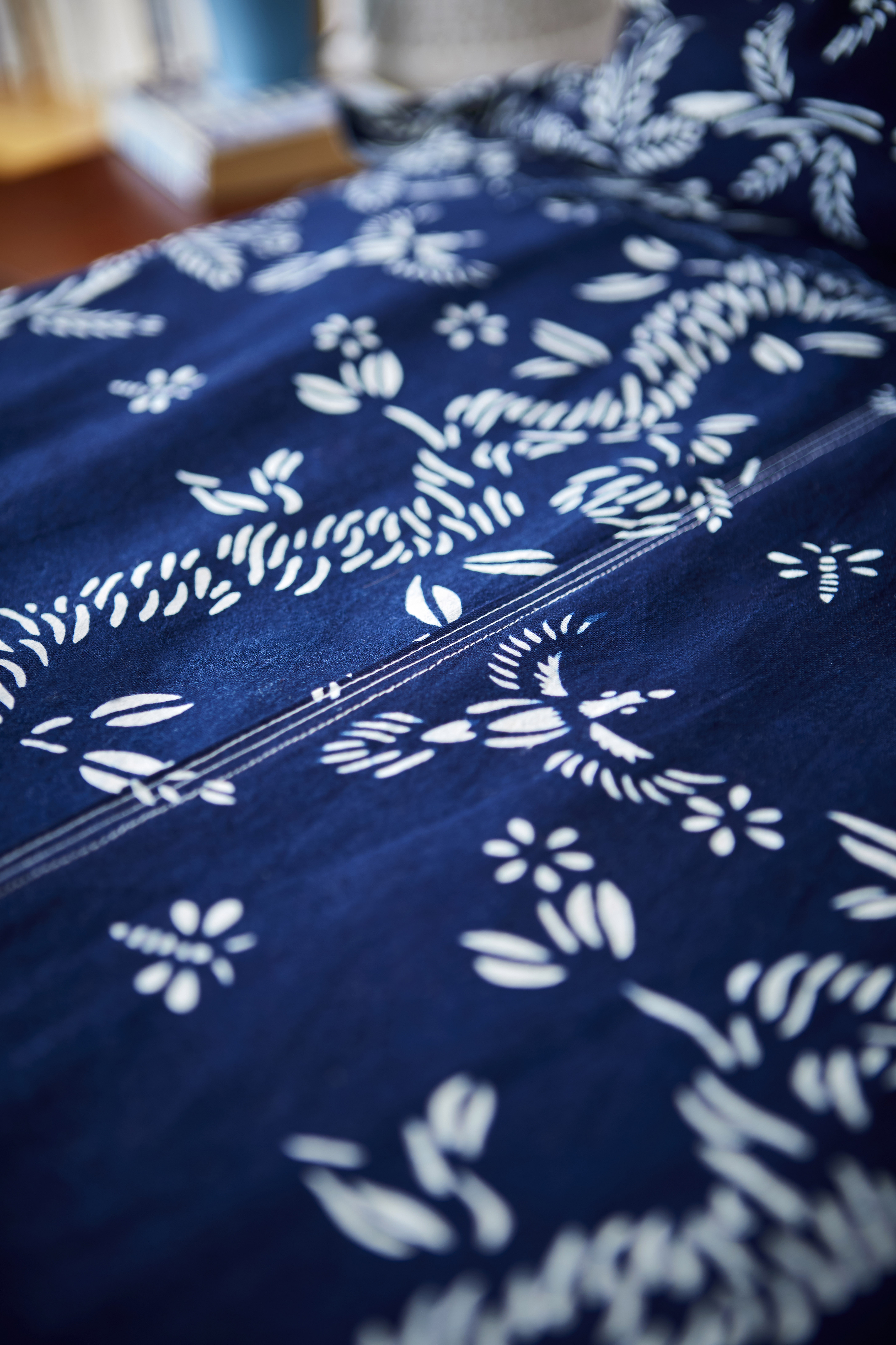 Birds & Bees cotton indigo dyed fabric artist collaboration with Alexandra McKenzie blue and white pattern fabric textile handmade natural flora fauna artist collaboration pattern ancient techniques contemporary design home interior decoration natural cotton hand crafted