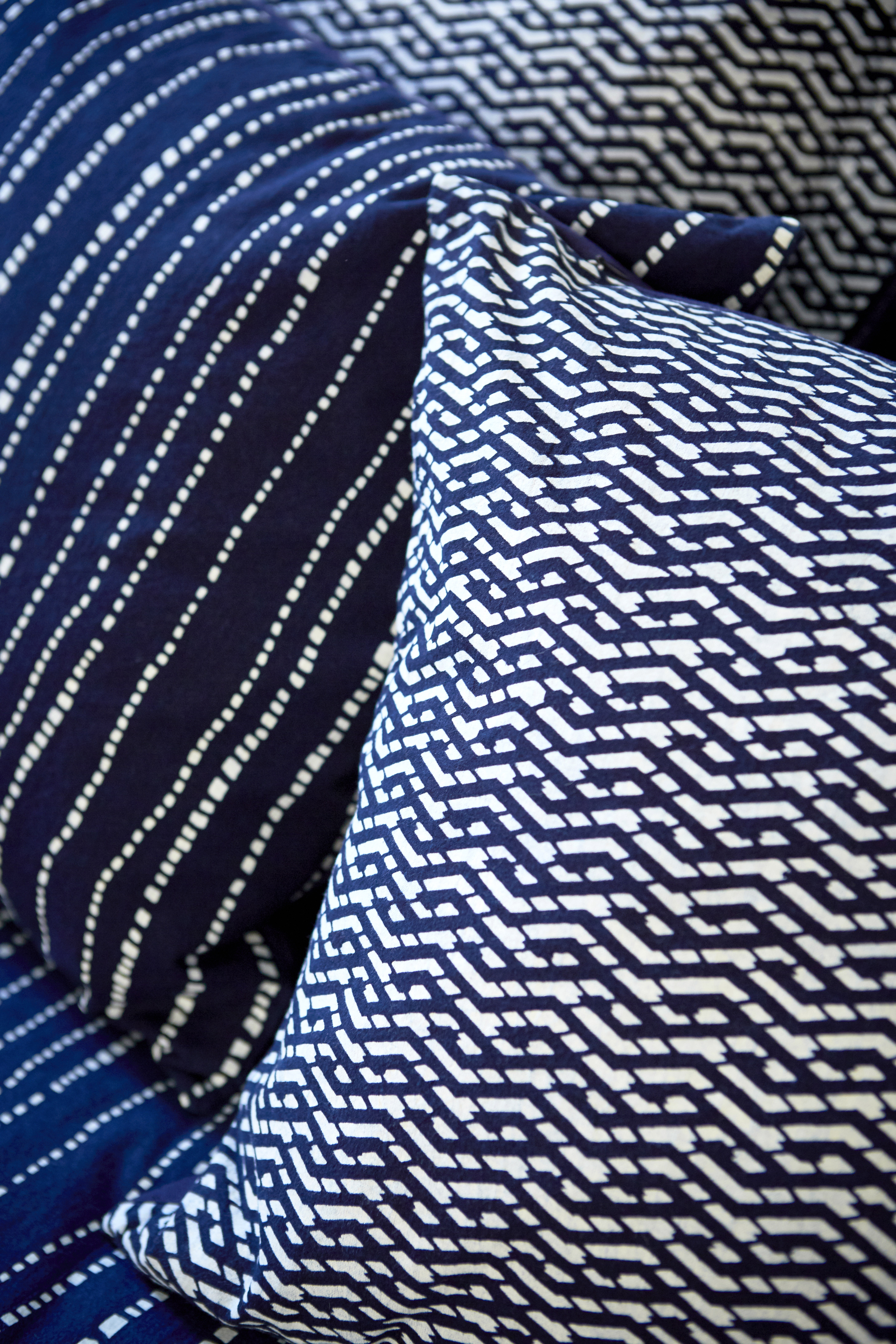 blue and white fabric textile indigo geometric contemporary interior design cushions pillows