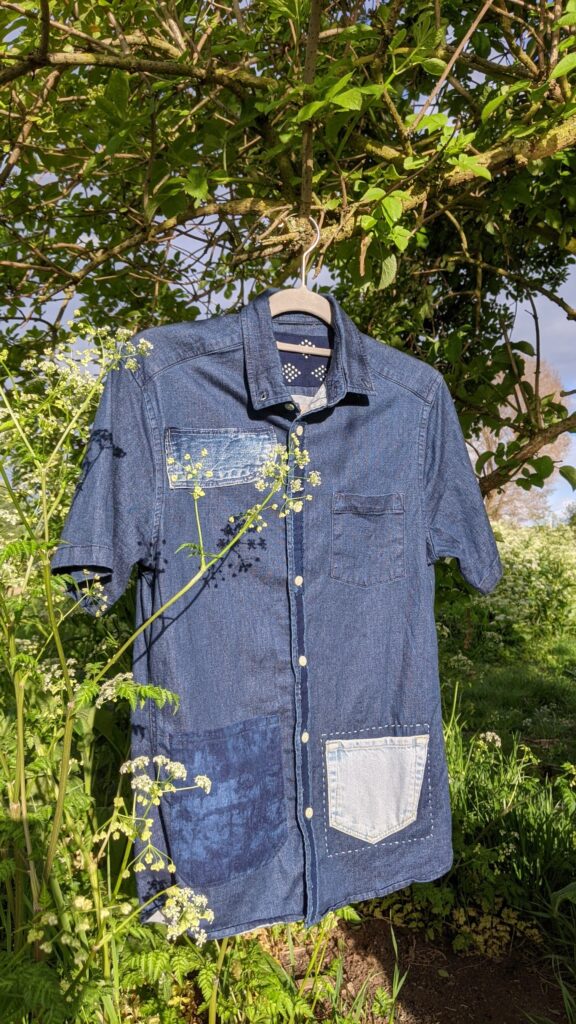 visible mended vintage clothing with indigo patches