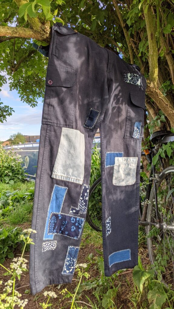 visible mended vintage clothing indigo patched trousers